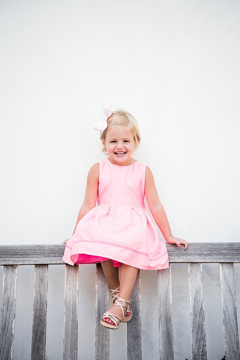 girl in pink beside the Rosemary Beach FLorida post office