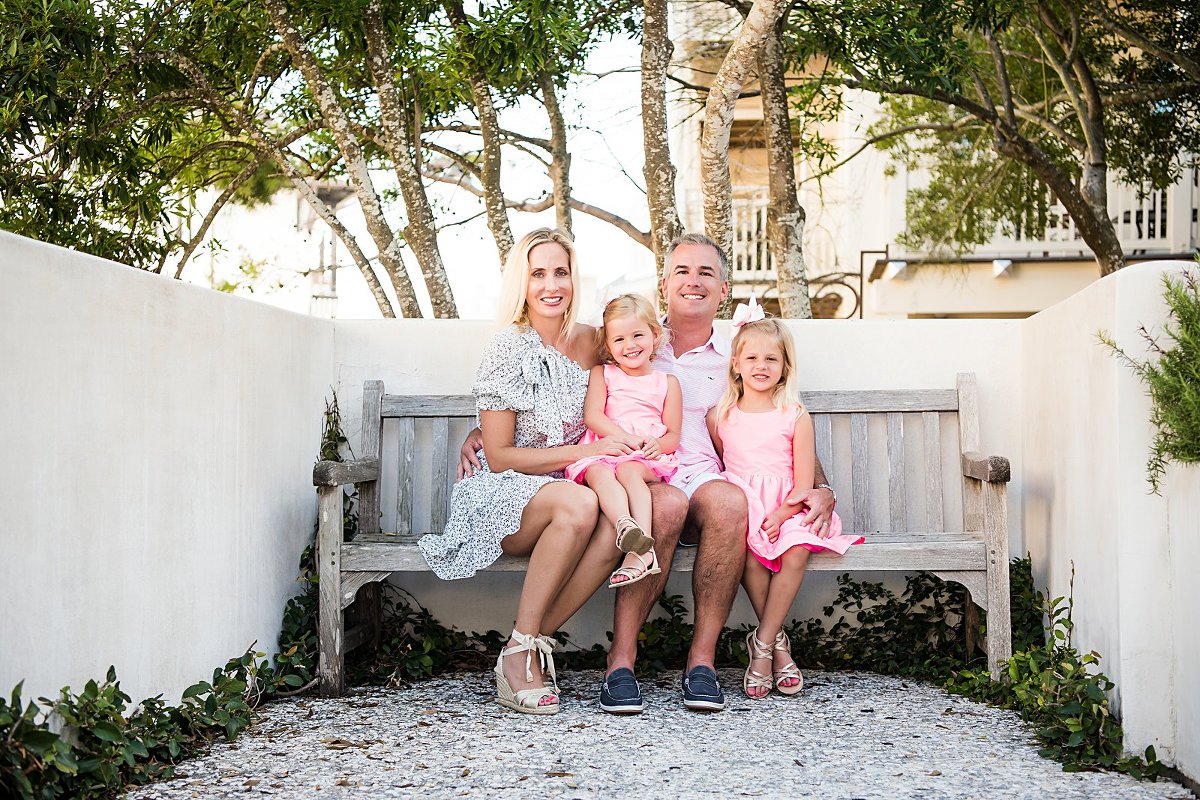 family of 4 in the Rosemary Beach Town Center with Rosemary Beach photographers Two Lights Photography